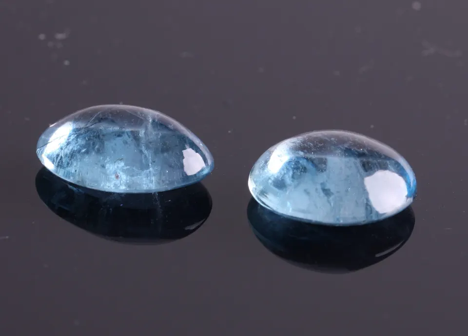 Aquamarin Pärchen, med.blue, oval Cabochon, 16,60ct